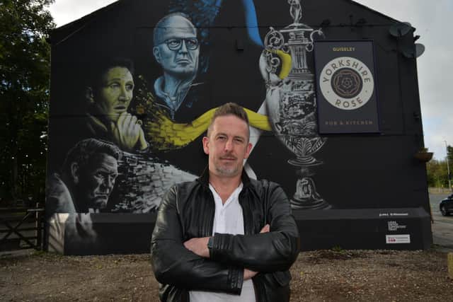 Street artist Phil Harris with the mural he did at The Yorkshire Rose pub at Guiseley.