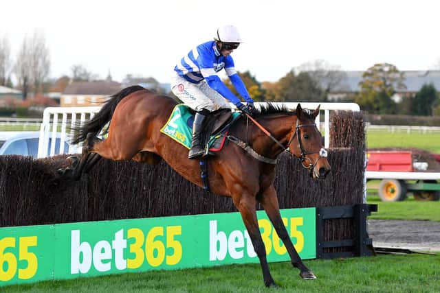 Cyrname and Harry Cobden clear the last in the 2020 Charlie Hall Chase. Photo: Alan Wright / Wetherby Racecourse.