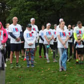 Runners taking part in a minute's silence before the run.

Photo: Steve Riding