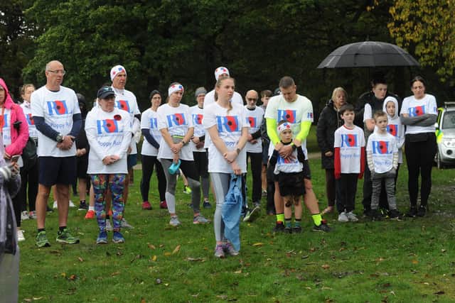 Runners taking part in a minute's silence before the run.

Photo: Steve Riding