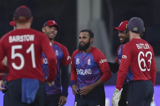TOP FORM: England's Adil Rashid, centre is congratulated by team-mates after taking the wicket of West Indies' Andre Russell in Dubai last week. Picture: AP/Aijaz Rahi