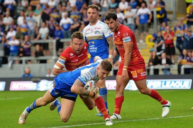 Liam Sutcliffe scores for Rhinos against Catalans. Picture by Jonathan Gawthorpe.
