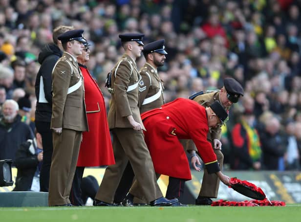 Armed forces lay wreathes at Carrow Road. Pic: Julian Finney.