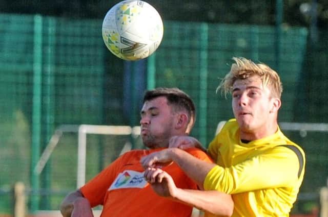 Kane Sanderson, right, of Old Centralians beats Wetherby Athletic's Ed Paxton to the ball during Saturday's West Yorkshire League Cup encounter. Picture: Steve Riding.