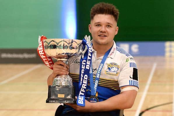 Leeds' Tom Halliwell with the wheelchair rugby league Betfred Super League trophy.  Picture by Richard Blaxall/SWpix.com