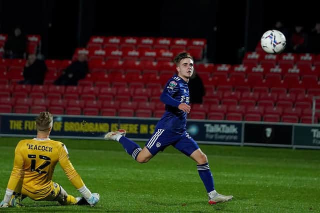 Leeds United's Lewis Bate chips the goalkeeper to make it 4-3 at the Peninsula Stadium. Pic: Bruce Rollinson.