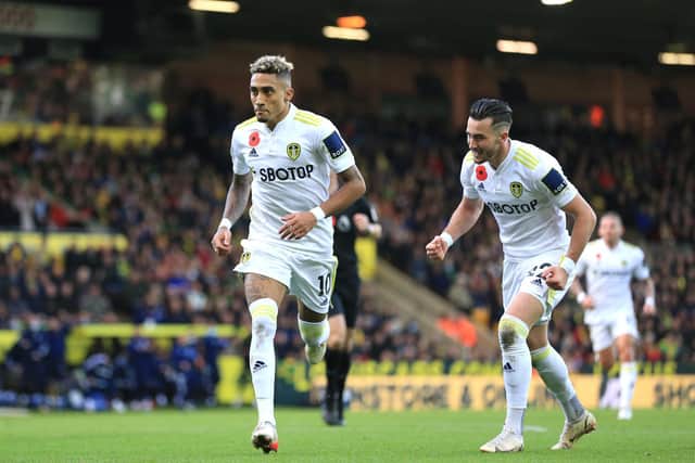 BREAKTHROUGH: Leeds United's star winger Raphinha, left, celebrates putting the Whites in front at Norwich City along with Jack Harrison, right, who started the game upfront. Photo by Stephen Pond/Getty Images.