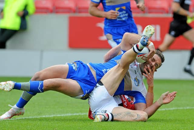 Luke Gale scores for Leeds against Salford in July. Picture by Steve Riding.