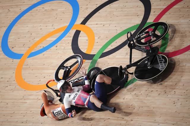Katy Marchant of Team Great Britain crashes with Laurine van Riessen of Team Netherlands (188) during the track cycling women keirin at the 2020 Summer Olympics. (AP Photo/Christophe Ena)