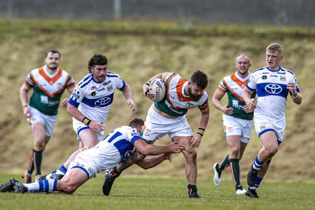 Harvey Hallas on the charge for Hunslet against Workington last season. Picture by Tony Johnson.