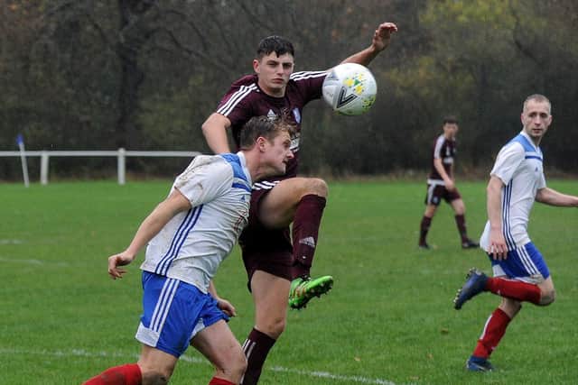 Jordan Wagstaff of Pool clears under pressure from Joe Clegg of Carlton. Picture: Steve Riding.