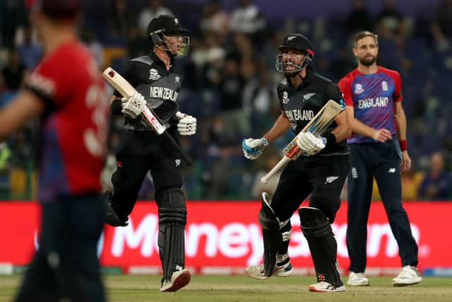 New Zealand's Daryl Mitchell (right) and Mitchell Santner celebrates after the ICC Men's T20 World Cup semi final win over England.