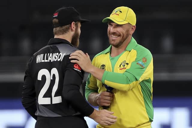 New Zealand's captain Kane Williamson, left, and Australia's captain Aaron Finch share a joke after Finch won the toss ahead of the final in Dubai Picture: AP/Aijaz Rahi