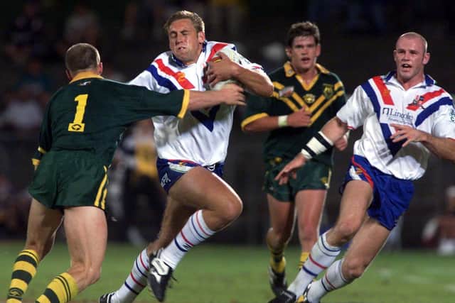 Andy Hay takes on Australia's Darren Lockyer during Great Britain's 1999 tour, as another Leeds man, Keith Senior, looks on. Picture by  Varley Picture Agency.