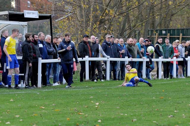 A bumper crowd watches Horbury Town's West Yorkshire League Premier Division clash with Horsforth St Margaret's. PIcture: Steve Riding.