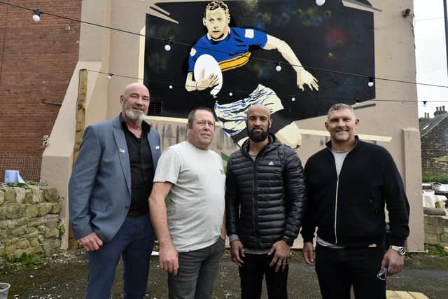 Rob Burrow mural launch at the Bay Horse Pub in Meanwood, Leeds. Pictured are Bay Horse regular Richard Sheridan who organised the mural,lLandlord Glen Barraclough and former team mates Jamie Jones Buchanan and  Barrie McDermott attended by a large crowd of regulars and Rhinos fans.
