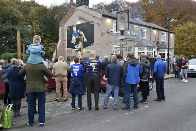 Pub regulars and Leeds Rhinos fans flocked to the Bay Horse pub in Meanwood on Sunday to catch a glimpse of the new mural that has been painted on the side of the pub as a tribute to Rob Burrow and his playing career and campaign for MND awareness.