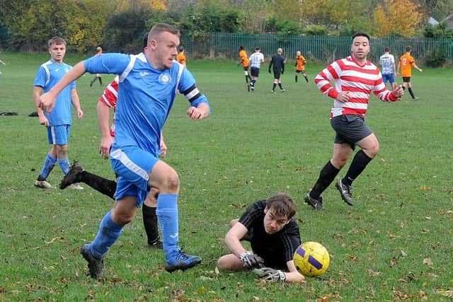 Sam Thorpe of Whitkirk Wanderers Blues races through against Leeds Hyde Park but ultimately overruns the ball. Picture: Steve Riding.