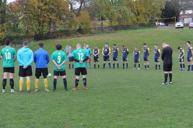The Dewsbury Rangers and North Leeds players pay their respects on Remembrance Day. Picture: Steve Riding.