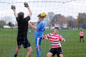Brandon Bennett of Whitkirk Wanderers Blues can only glance a header wide against Leeds Hyde Park. Picture: Steve Riding.