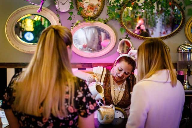The 90-minute alternate reality experience includes two bespoke cocktails and the 'Eat Me' cake for £28 per person