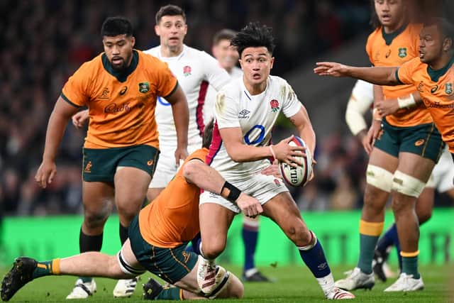 Marcus Smith of England, who wants to train at Leeds Rhinos to 'toughen him up', is tackled by Izack Rodda of Australia (Picture: Shaun Botterill/Getty Images)