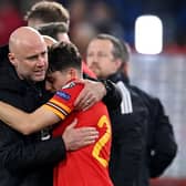 SEEDED: Leeds United winger Dan James hugs Wales boss Rob Page after Tuesday's 1-1 draw at home to Belgium which ensured the Dragons are in pot one and with home advantage in the World Cup qualifying play-offs. Photo by PAUL ELLIS/AFP via Getty Images.