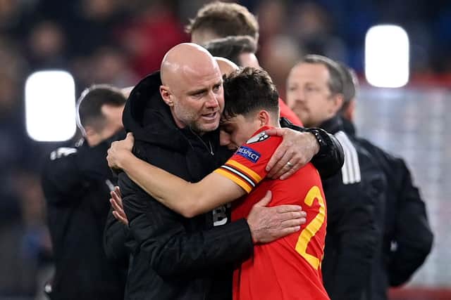 SEEDED: Leeds United winger Dan James hugs Wales boss Rob Page after Tuesday's 1-1 draw at home to Belgium which ensured the Dragons are in pot one and with home advantage in the World Cup qualifying play-offs. Photo by PAUL ELLIS/AFP via Getty Images.