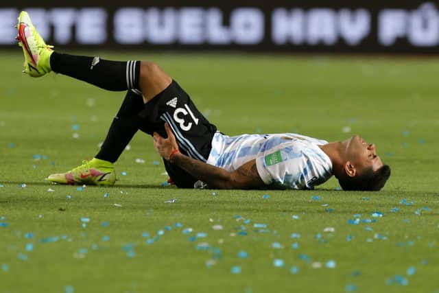 FORCED OFF: Tottenham's Argentina international defender Cristian Romero goes down injured in the goalless draw against Brazil in the early hours of Wednesday morning. Photo by Daniel Jayo/Getty Images.