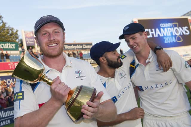 Winner: Azeem Rafiq helped Yorkshire win the County Championship in 2014 under then captain and current coach Andrew Gale - who is currently suspended by the club. Picture by Allan McKenzie/SWpix.com