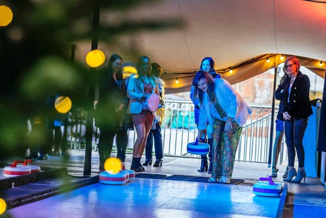 This is what is on this Christmas in Leeds - everything from food festivals, festive markets, ice rinks and art installations. Pictured is people enjoying curling at Chow Down food festival in Temple Arches.