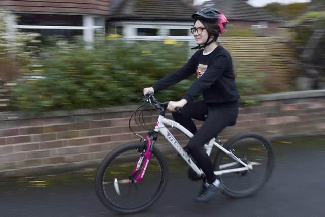 Esther, 12, wants to cycle the 150km route from Leeds to Wigan Pier having been inspired by author George Orwell and England footballer Marcus Rashford. Picture: Steve Riding.