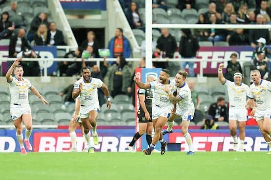 Kruise Leeming, third from left, celebrates his golden-point drop goal which secured victory for Rhinos over Hull at the 2021 Magic Weekend. Picture by John Clifton/SWpix.com.