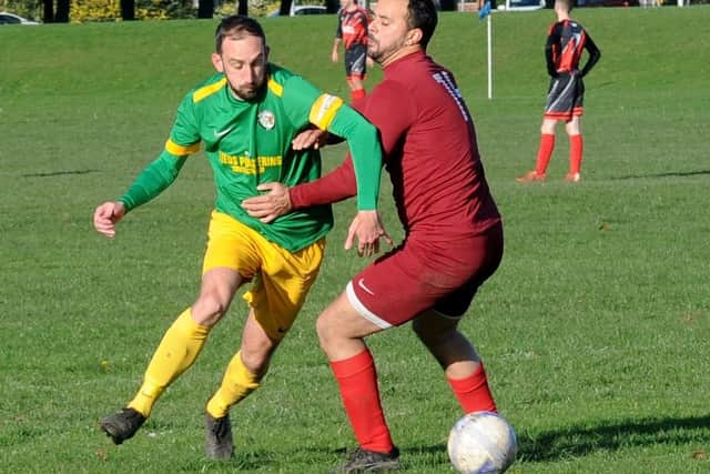 Main Line Social goalscorer Andrew Gallagher is closed down by Kwan Westerman, of Littrle London, during Sunday's Senior Challenge Cup tie. Picture: Steve Riding.