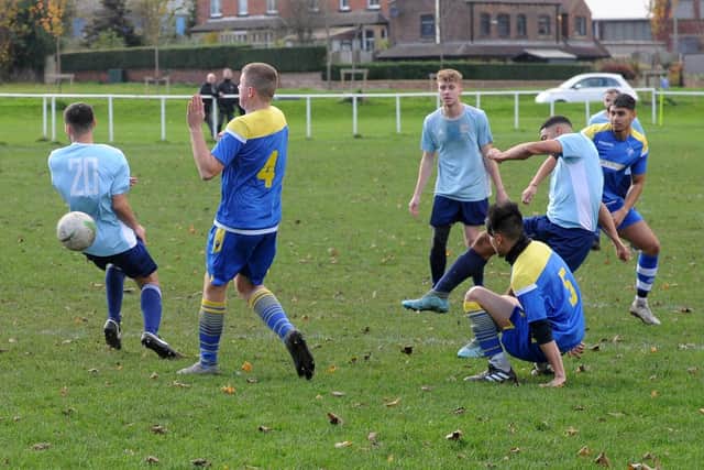 Danny Lyons scores  for Farsley Celtic Juniors in the 9-0 Yorkshire Amateur League Supreme win at Drighlington. Picture: Steve Riding.