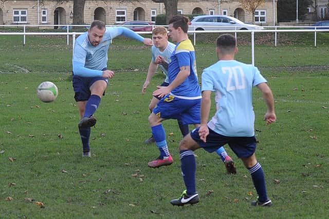 Danny Kemp scores the opener for Farsley Celtic Juniors in the 9-0 Yorkshire Amateur League Supreme win at Drighlington. Picture: Steve Riding.