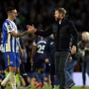 Brighton defender Lewis Dunk greets manager Graham Potter. Pic: Getty