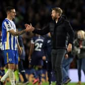 Brighton defender Lewis Dunk greets manager Graham Potter. Pic: Getty