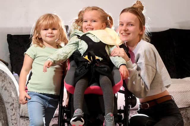 Imogen Holmes (centre) pictured with her sister Delilah, four, and mum Briony Winstanley.

Photo: Simon Hulme