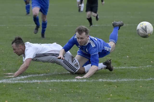 Jake Topp, of Beeston St Anthonys, is brought down in Saturday's Leeds and District Challenge Cup tie by Headingley defender Joe Cooper who was sent off as he was the last man. Picture: Steve Riding.