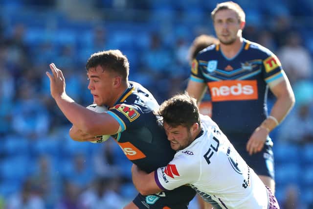 Jai Whitbread, left, in action for Gold Coast Titans. Picture by Getty Images.
