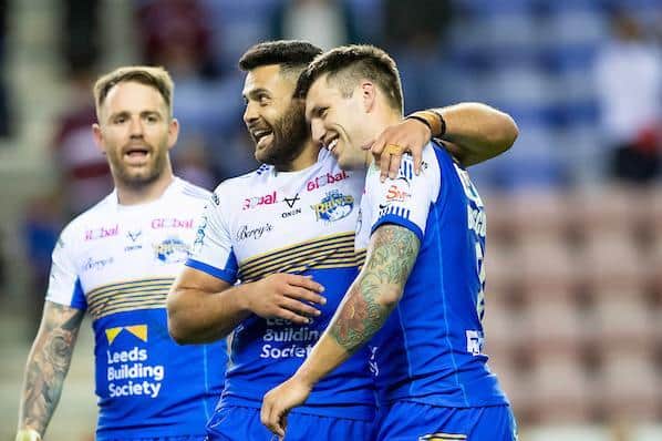 Richie Myler, left, Rhyse Martin, centre and Tom Briscoe celebrate Rhinos' play-off win at Wigan two months ago. Picture by Allan McKenzie/SWpix.com.