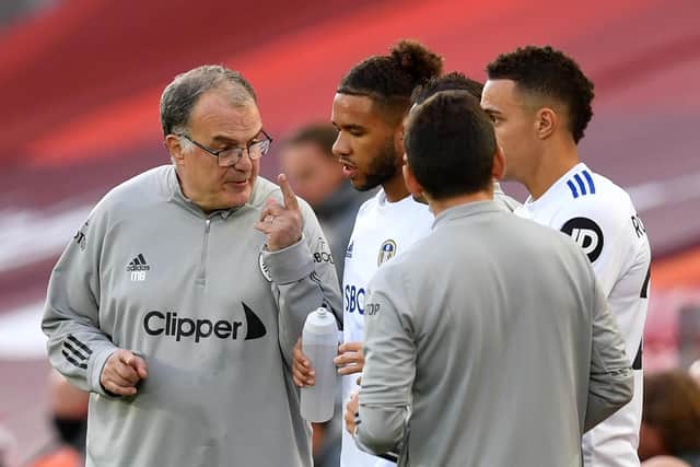 SUPPORT: Leeds United boss Marcelo Bielsa, left, with Tyler Roberts, centre, during the Premier League clash at Liverpool back in September 2020. Photo by PAUL ELLIS/POOL/AFP via Getty Images.