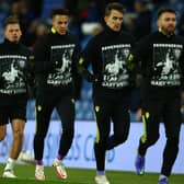 TRIBIUTE: Leeds United's players pay their respects to Gary Speed in the warm-up for Saturday's Premier League clash at Brighton. Photo by Charlie Crowhurst/Getty Images.