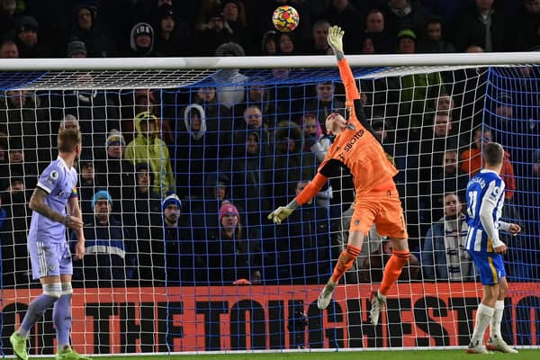 FINE SAVE: Leeds United goalkeeper Illan Meslier tips Solly March's rising shot over the bar. Photo by GLYN KIRK/AFP via Getty Images.