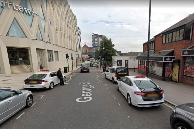 An investigation has been launched after a woman was knocked down and had her phone stolen in Leeds. Photo: George Street. Google.
