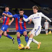 Leeds United striker Patrick Bamford tussles with Crystal Palace's Gary Cahill at Elland Road. Pic: Stu Forster.