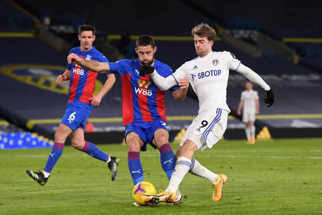 Leeds United striker Patrick Bamford tussles with Crystal Palace's Gary Cahill at Elland Road. Pic: Stu Forster.