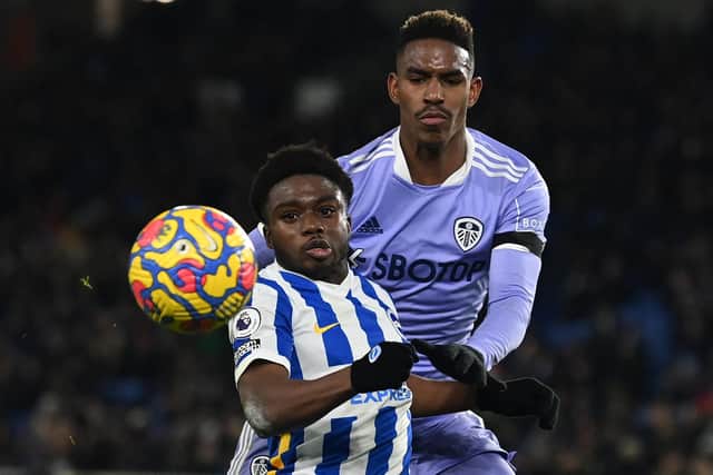 BACKING: From Leeds United head coach Marcelo Bielsa for Whites left back Junior Firpo, top, pictured grappling with Tariq Lamptey in Saturday's goalless draw at the Amex. Photo by GLYN KIRK/AFP via Getty Images.