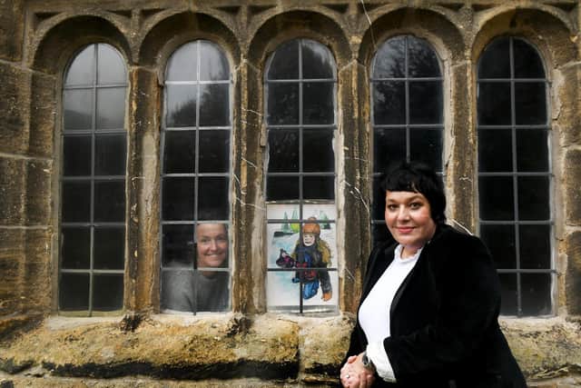 Artist Joanne Tinker (left) and Artist Louise Hepworth-Wood, designer of the Ilkley Manor House Advent Calendar, with the December 1 picture of locals sledging in Ilkley (Photo: Gary Longbottom)